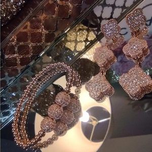 Rose gold bracelet and earrings set.